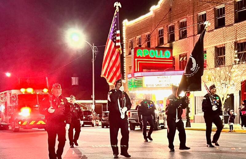 Veterans walk past the Apollo Theatre for the annual Christmas Parade on Friday, Dec. 6, 2024 downtown Princeton.