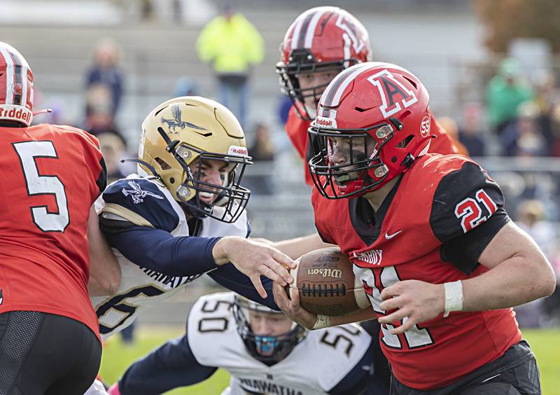 Amboy’s Quinn Leffelman picks up yards against Hiawatha Saturday, Oct. 28, 2023 in the I8FA playoffs in Amboy.