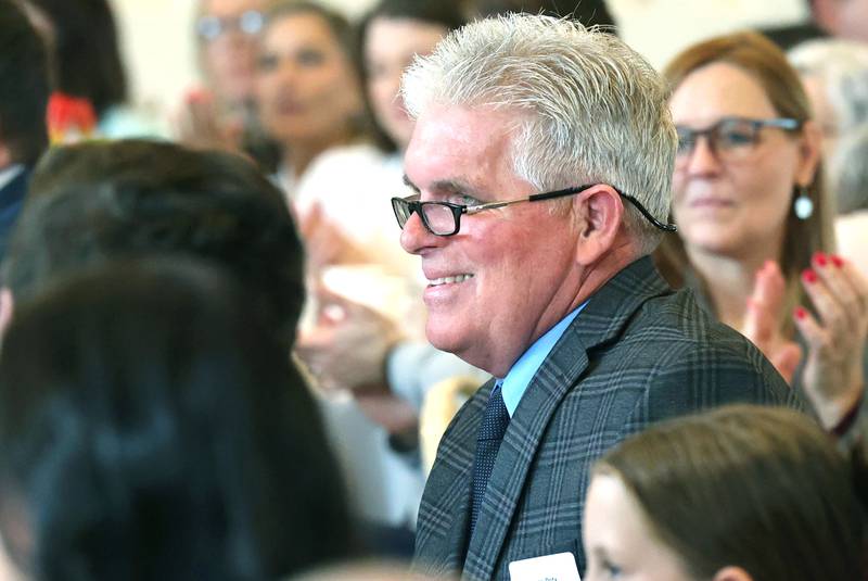 Sycamore Chamber of Commerce Clifford Danielson Outstanding Citizen Award winner Thomas Doty, of Doty & Sons, smiles as he listens to past winner Kathy Countryman talk about his achievements during the 106th Annual Chamber Meeting Thursday, March 2, 2023, in Memorial Hall at St. Mary's Catholic Church in Sycamore.