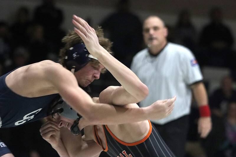 Crystal Lake Central’s Nick Zuehlke, right, battles Cary-Grove’s Tanner Hurley at 150 pounds in varsity wrestling Thursday, Dec. 19, 2024 at Cary-Grove High School in Cary.
