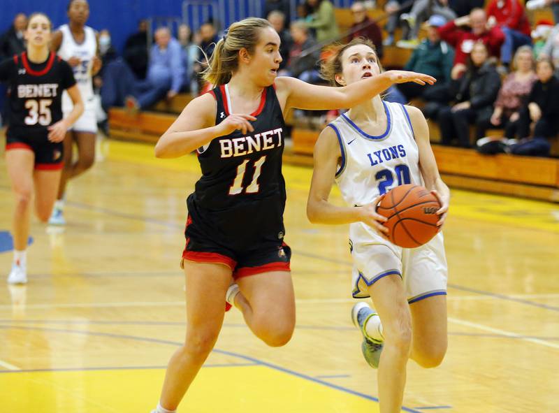 Benet's Sadie Sterbenz (11) tries to stop Lyons' Ella Ormsby (20) during the girls varsity basketball game between Benet Academy and Lyons Township on Wednesday, Nov. 30, 2022 in LaGrange, IL.