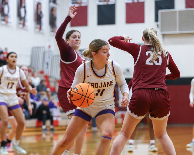 Downers Grove North's Abby Gross (11) makes a move under the basket during their Regional Final basketball game between Downers Grove North at Plainfield North. Feb 20, 2025 in Plainfield.