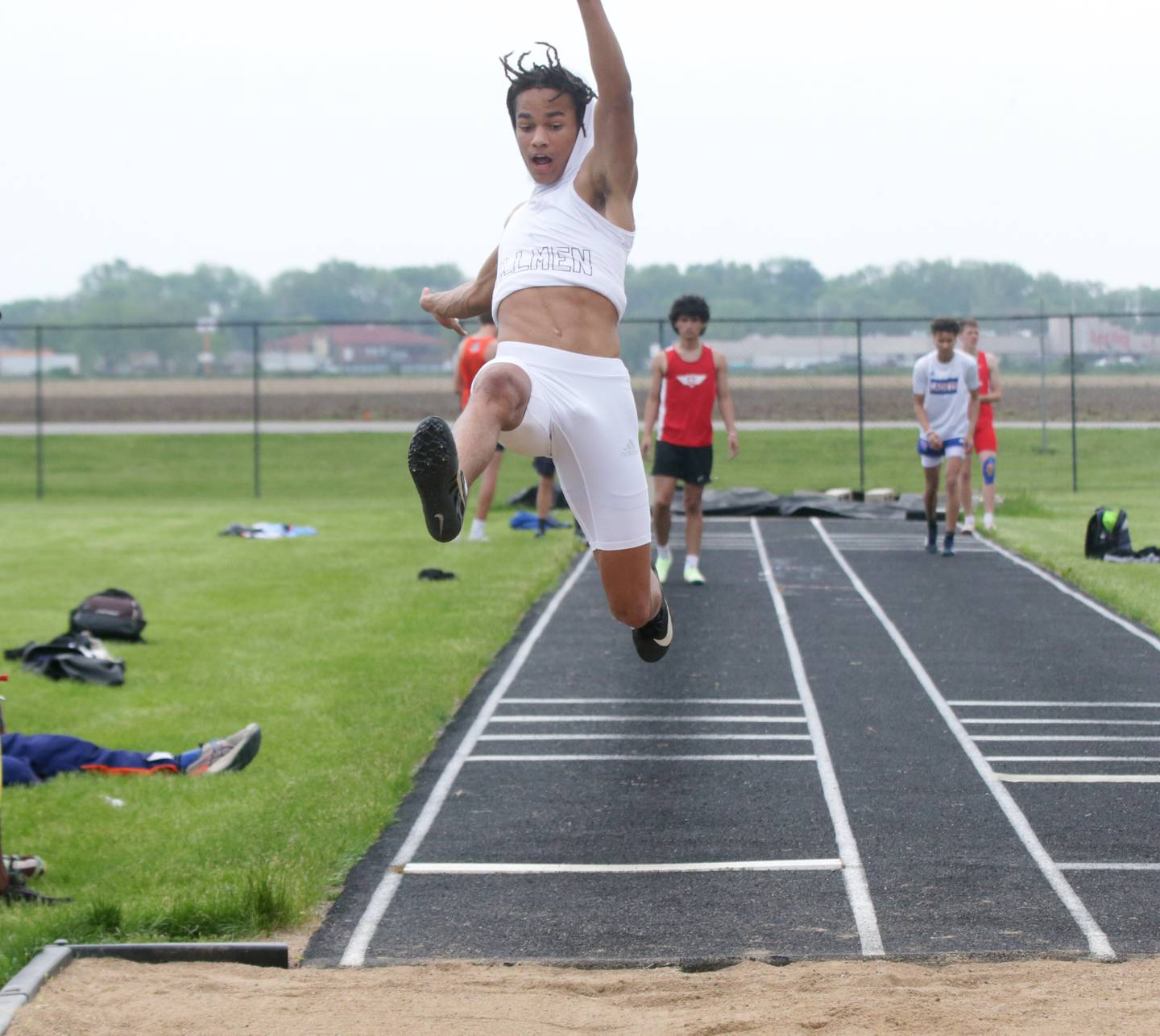 Joliet Catholic's Adrian Washington competes in the long jump in the Class 1A Boys Sectional track meet on Friday, May 20, 2022 in Plano.