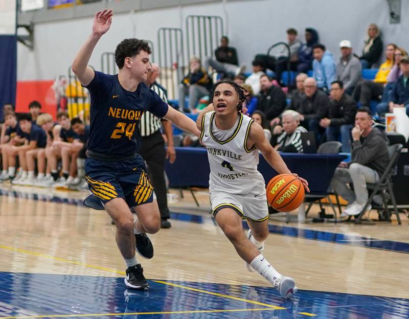 Yorkville Christian's Tray Alford (4) drives to the basket against Neuqua Valley's Danny Podpora (24) during a basketball game at Yorkville Christian High School on Tuesday, February 4, 2025.