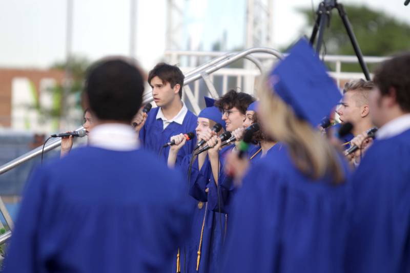 Members of the Lyons Township High School Senior Madrigals perform the National Anthem during the school’s 2023 commencement ceremony in Western Springs on Wednesday, May 31, 2023.