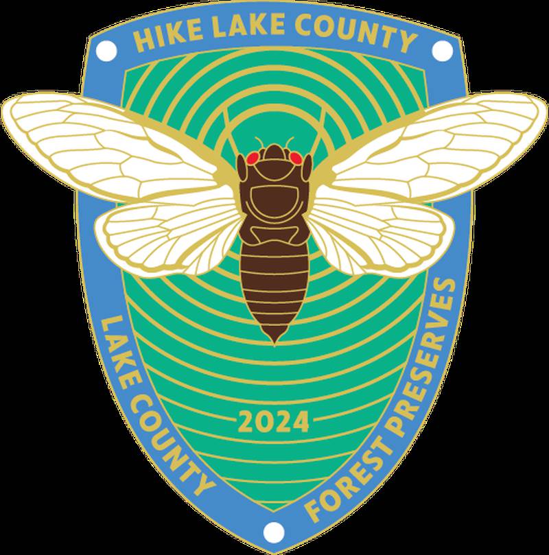 A periodical cicada is featured on commemorative shields and zipper pulls this year.