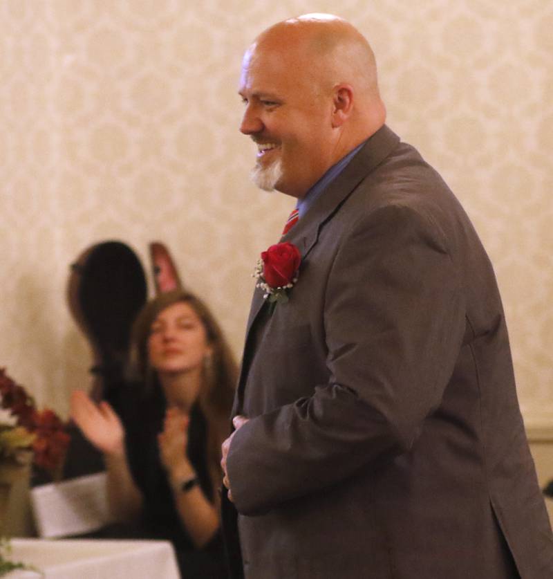 John Beerbower of McHenry High School walks to the stage after winning the administrator award during the the Educator of the Year Dinner, Saturday, May 6, 2023, at Hickory Hall, in Crystal Lake. The annual awards recognize McHenry County’s top teachers, administrators and support staff.