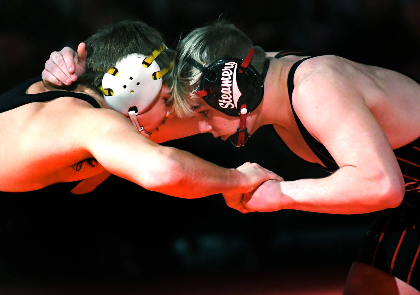 Fulton's Zane Pannell (right) and Riverdale's Alex Watson lock up at the start of their championship match at 170 pounds at the 1A Oregon Wrestling Sectional on Saturday. Pannell won the match, but both wresetlers advance to the state finals.