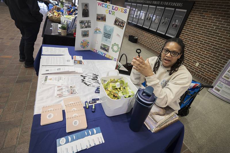 Whiteside County Senior Center Activities Director Devon Neal talks about the volunteer options available Thursday, April 2, 2026, while attending Lifescape AmeriCorps Senior Volunteer Fair at SVCC.
