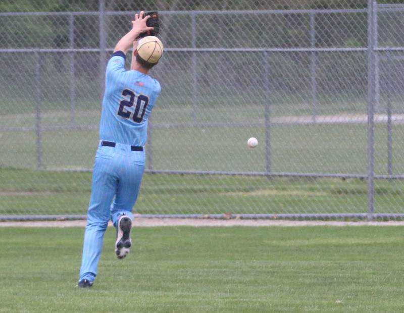 Marquette's Charlie Mullen chases after a ball in the outfield against St. Bede at Masinelli Field on Thursday, April 18, 2024 in Ottawa.