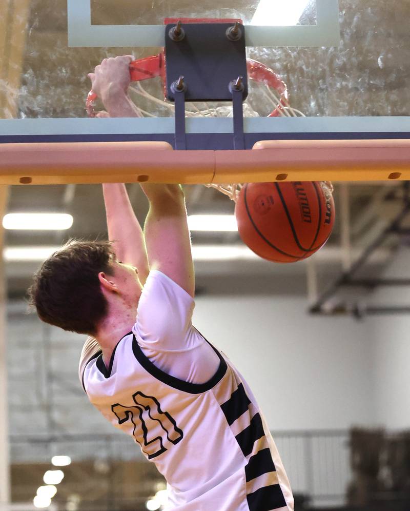 Sycamore's Ben Larry slams home two points during their game against Mendota Wednesday, Dec. 13, 2023, at Sycamore High School.