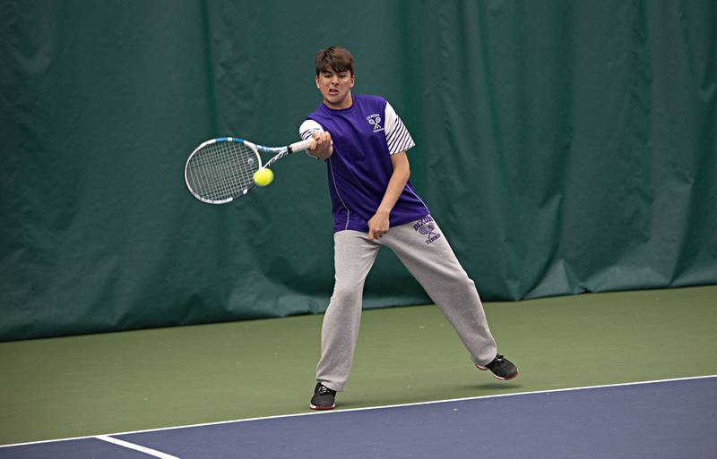 Dixon's Kaiser Khawaja plays a shot against the Sterling doubles team of Carter Harris and Hunter Lofgren Thursday, May 5, 2022.