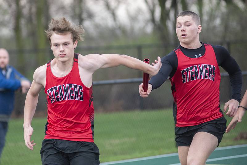 Fulton's Lucas Hartman takes the baton from Joel Ford in the 4 x100 Friday, April 22, 2022 at the Rock Falls track invitational.