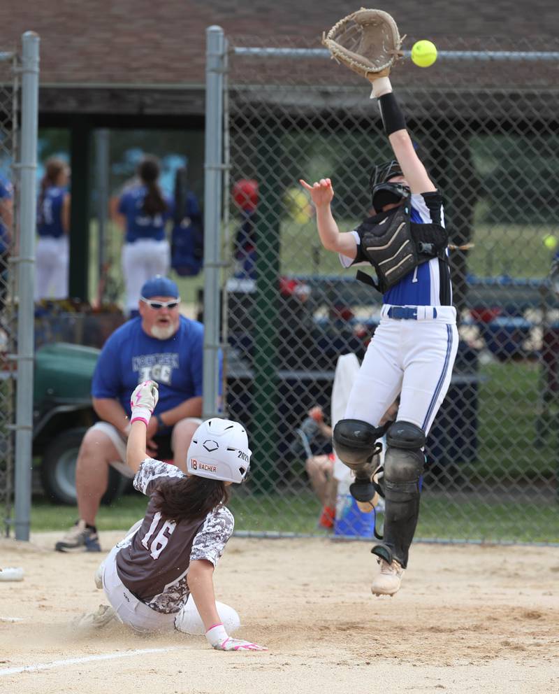 The Kishwaukee Valley Storm score a run as the throw comes in high Friday, June 27, 2025, during their 16u game against Northern Ice in the Storm Days tournament at the Sycamore Community Sports Complex.