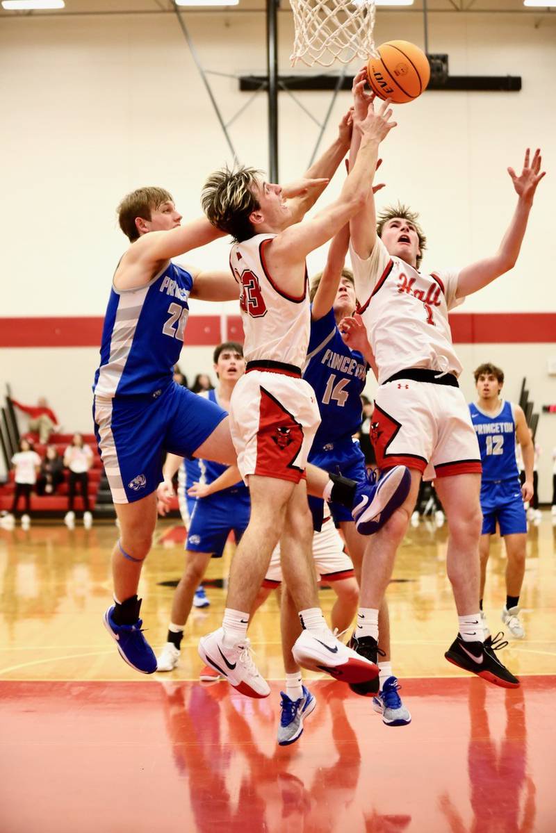 Hall's Braden Curran and Wyatt West battle the Tigers for a rebound Friday night at Hall High School. The Red Devils won 62-54.