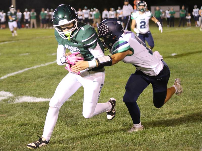 St. Bede's Drew Carboni runs the ball as Peoria Notre Dame's Kellan McCavitt takes him down on Friday, Oct. 17, 2025 at St. Bede Academy.
