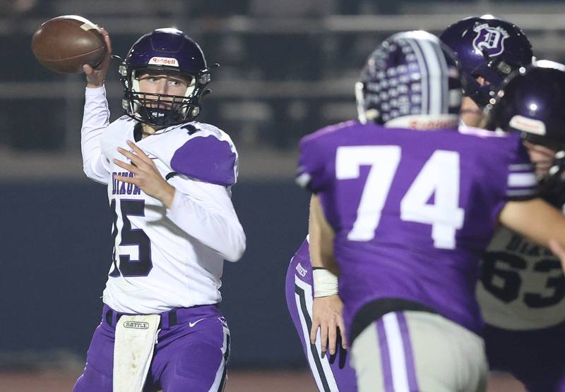 Dixon’s Tyler Shaner throws a pass as Rochelle's Bradley Cooney gets pressure during their first round playoff game Friday, Oct. 28, 2022, at Rochelle High School.