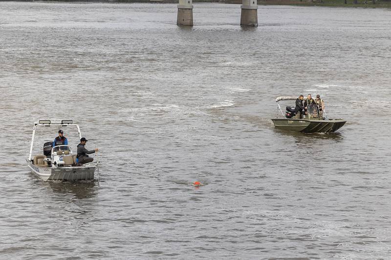 Search squads check the Rock River in Dixon Tuesday, April 14, 2026, after an individual jumped over the railing off of the Peoria Avenue Bridge late Monday night.
