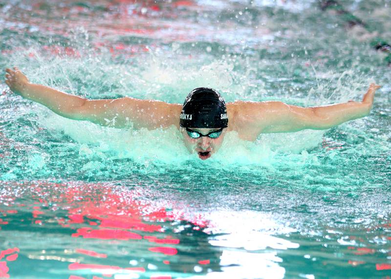 Cary-Grove co-op’s Danial Sanahurskyj competes in the 100-yard butterfly at the Fox Valley Conference Boys Swimming Invite at Woodstock North on Saturday.
