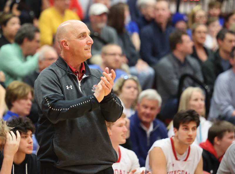 Hinsdale Central's coach Nick Latorre watches the action during the boys 4A varsity sectional semi-final game between Hinsdale Central and Lyons Township high schools in Hinsdale on Wednesday, March 1, 2023.