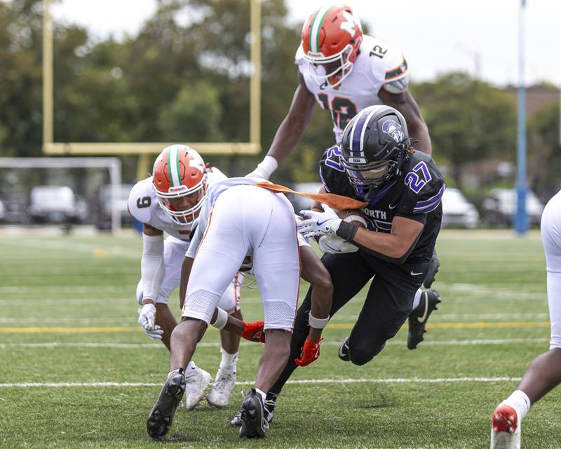 Downers Grove North's Kevin Jay Jr. (27) falls over the goal line for a touchdown during football game between Downers Grove North at Morgan Park Saturday, Aug 30, 2025  in Chicago.