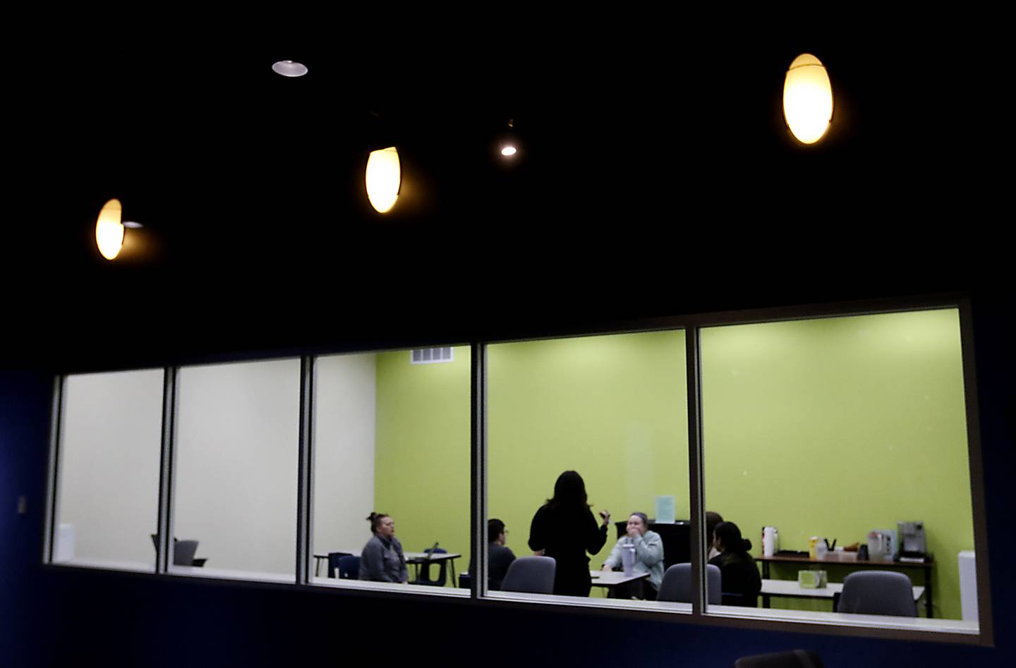 Students take part in an undergraduate class at Aurora University Woodstock Center on Wednesday, March 29, 2023. McHenry County College recently announced a plan to purchase the building and launch a new University Center at the location. The University Center will give local students the ability to obtain a bachelor’s degree from partnering universities in McHenry County.