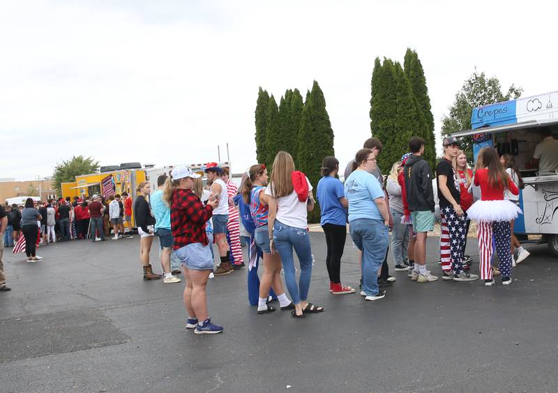Putnam County High School Students throw corn hole bags while attending the first annual Homecoming Parking Lot Party and Food Truck Festival on Monday, Sept. 23, 2024 at Putnam County High School. The Putnam County High School Student Council and the Work-Based Learning Program came up with the idea.