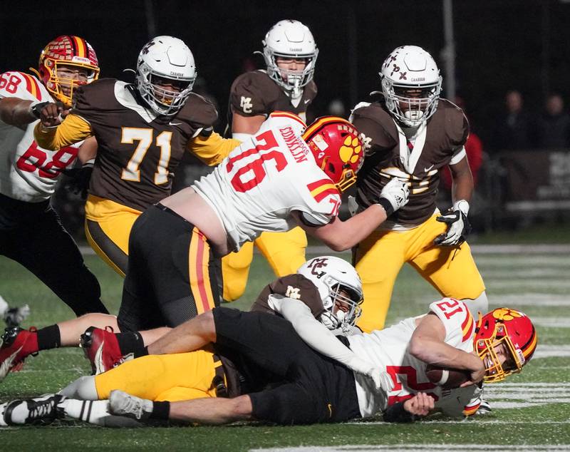 Mt. Carmel's Daniel Banks (44) sacks Batavia’s Ryan Boe (21) for a loss during a class 7A semifinal football playoff game at Mt. Carmel High School in Chicago on Saturday, Nov 18, 2023.