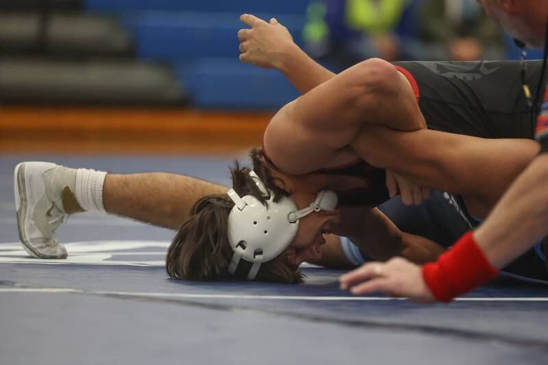 Plainfield North’s Lucas Frydrychowski moves to pin Plainfield South’s Damien Angniano in a Southwest Prairie dual meet on Wednesday, Nov. 29, 2023 in Plainfield.