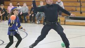 Photos: Peru and Spring Valley Police officers team up to play dodgeball at Peru Catholic School. 