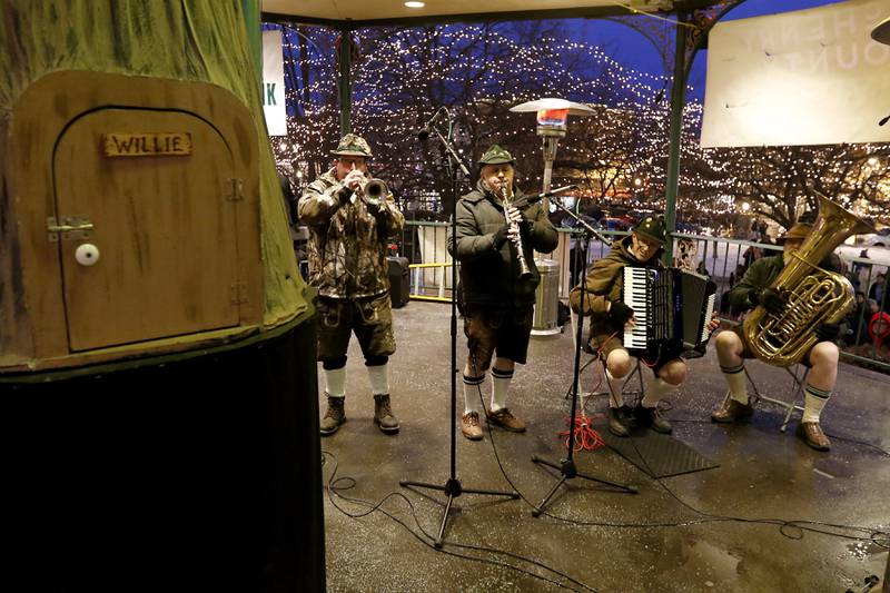 Members of Die Musik Meisters performa poke music on Sunday, Feb. 2, 2025, during the annual Groundhog Day Prognostication in the Woodstock Square.