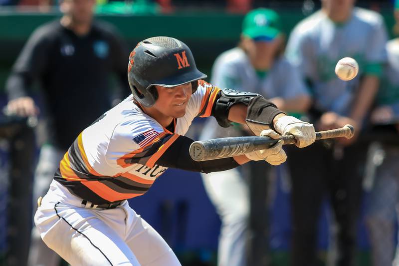 McHenry's Cooper Cohn (9) bunts during the Class 4A Supersectional game between York at McHenry.  June 7, 2022.