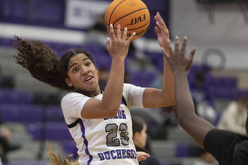 Dixon’s Ahmyrie McGowan takes a pass against Kaneland Wednesday, Dec. 10, 2025.