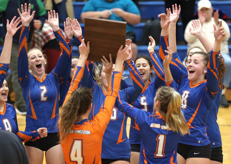 Genoa-Kingston players celebrate as Hannah Langton brings over the regional championship plaque Thursday, Oct. 27, 2022, after their Class 2A Regional final win over Marengo at Rosary High School in Aurora.