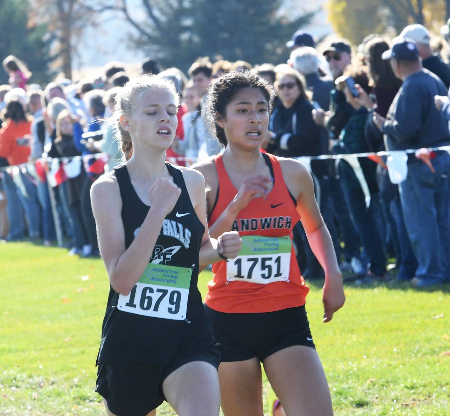 Rock Falls' Kat Scott and Sandwich's Joanna Rivera race to the finish line at the 1A Oregon Sectional on Saturday, Oct. 29.