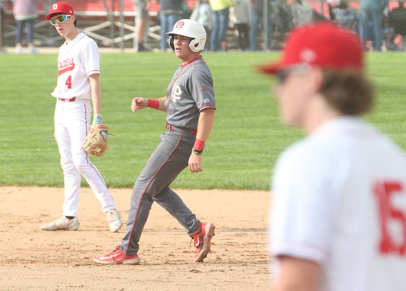 L-P's Kaedin Bond rounds second base as Ottawa's Colt Bryson watches the play on Friday, May 2, 2025 at Ottawa High School.