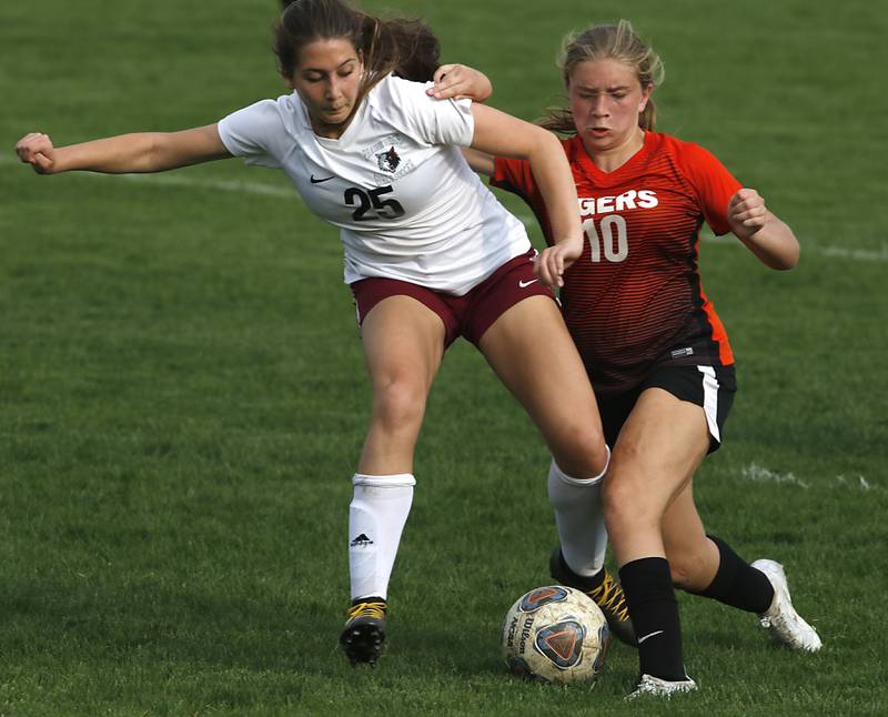 Prairie Ridge's Marissa Hall battles with Crystal Lake Central's Brooklynn Carlson for the ball during a Fox Valley Conference soccer match Tuesday, May 10, 2022, between Crystal Lake Central and Prairie Ridge at Crystal Lake Central High School.