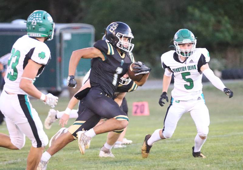 St. Bede's Jose DeLaTorre runs the ball against Seneca's Avery Phillips and teammate Brady Sheedy Friday, Sept. 20, 2024 at St. Bede Academy.