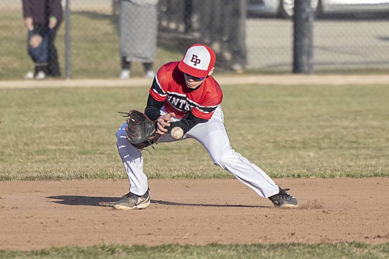 Erie-Prophetstown’s Bryce Jepson stays with a grounder for an out against Rock Falls Monday, March 27, 2023.