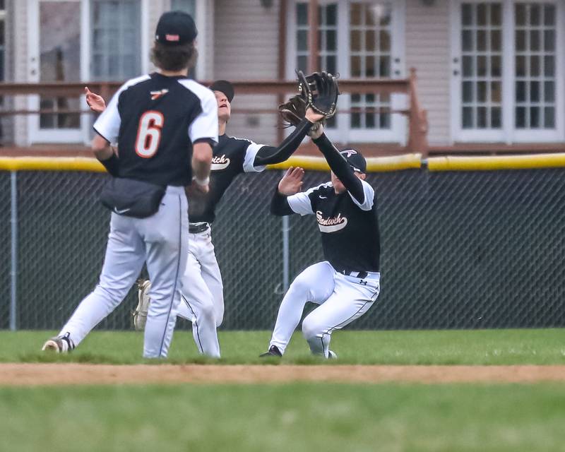 Sandwich's Nick Michalek (15) and Nolan Oros (14) converge in the outfield while the ball drops in during baseball game between Sandwich at Plano on Thursday, April 9, 2025 in Plano.
