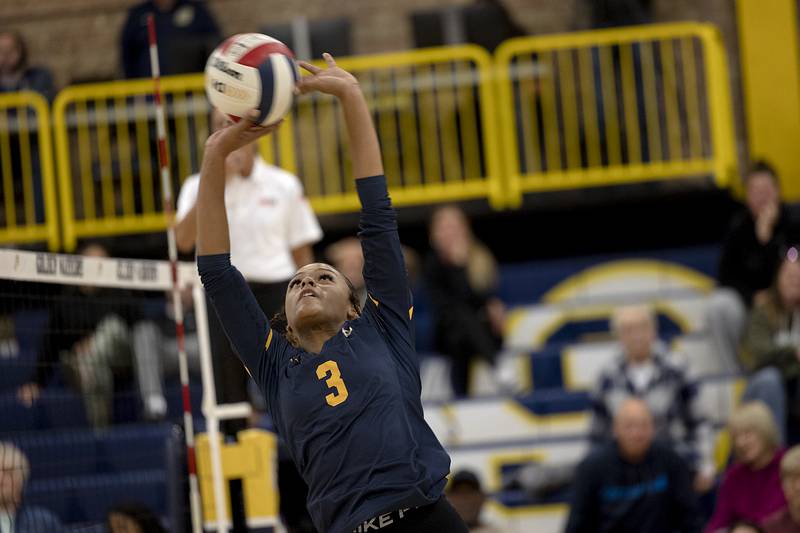 Sterling’s Delali Amankwa sneaks a shot over the net against United Township Tuesday, Oct. 15, 2024, in Sterling.