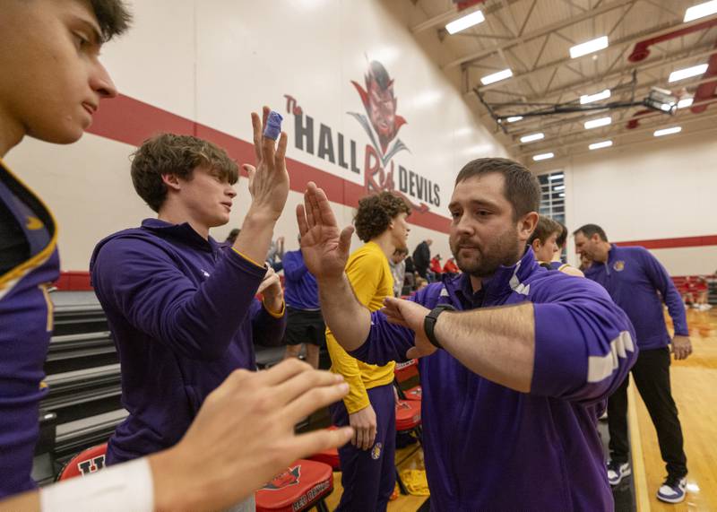 Mendota's assistant coach Nick Ganz celebrates Mendota's IHSA 2A Regional Semifinal win over Hall High School after the game on February 19, 2024.