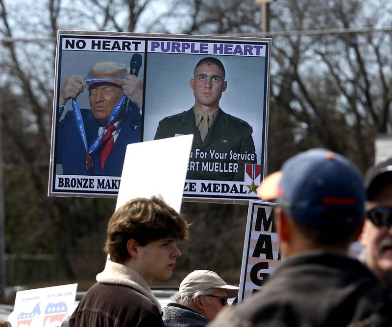 A protest sign near the intersection of McCullom Lake Road and State Route 31, on Saturday, March 28, 2026, during the McHenry County No Kings Protest. According to an organizer, over 4,000, people took part in the protest.