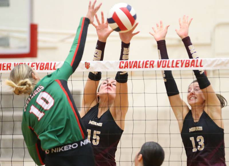 Morris's Lily Hansen blocks the ball from L-P's Kelsey Frederick on Thursday, Oct. 10, 2024 in A.J. Sellett Gymnasium at L-P High School.
