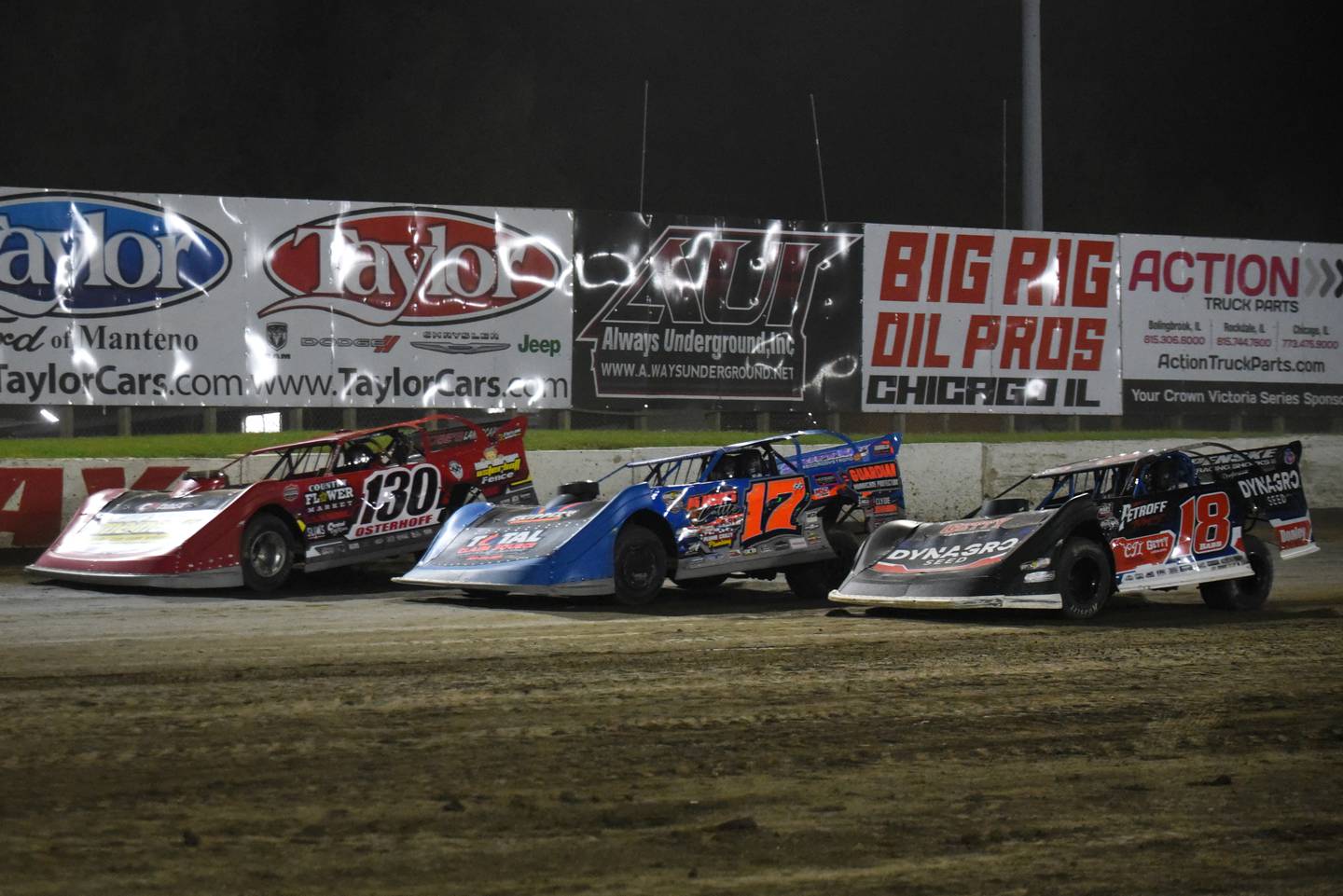 From left, Chase Osterhoff, Brenden Smith and Shannon Babb race down the backstretch during the DIRTcar Summer Nationals late model feature at Kankakee County Speedway Wednesday, June 11, 2025.