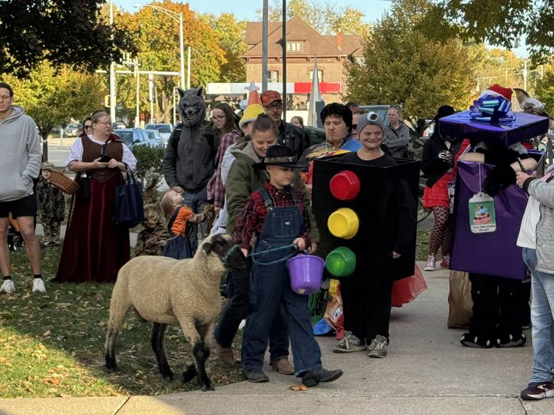 Michael, from Morris, dressed as a farmer and even brought his own live sheep with him on Thursday, Oct. 30, 2025.