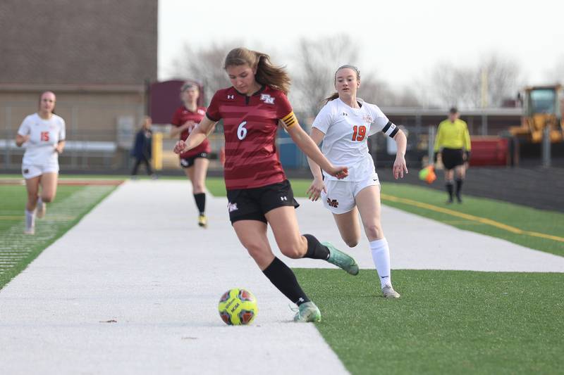 Minooka’s defender Jessica Stewart kicks the ball back to the goalkeeper during the game against Plainfield North. Monday, Mar. 14, 2022, in Plainfield.