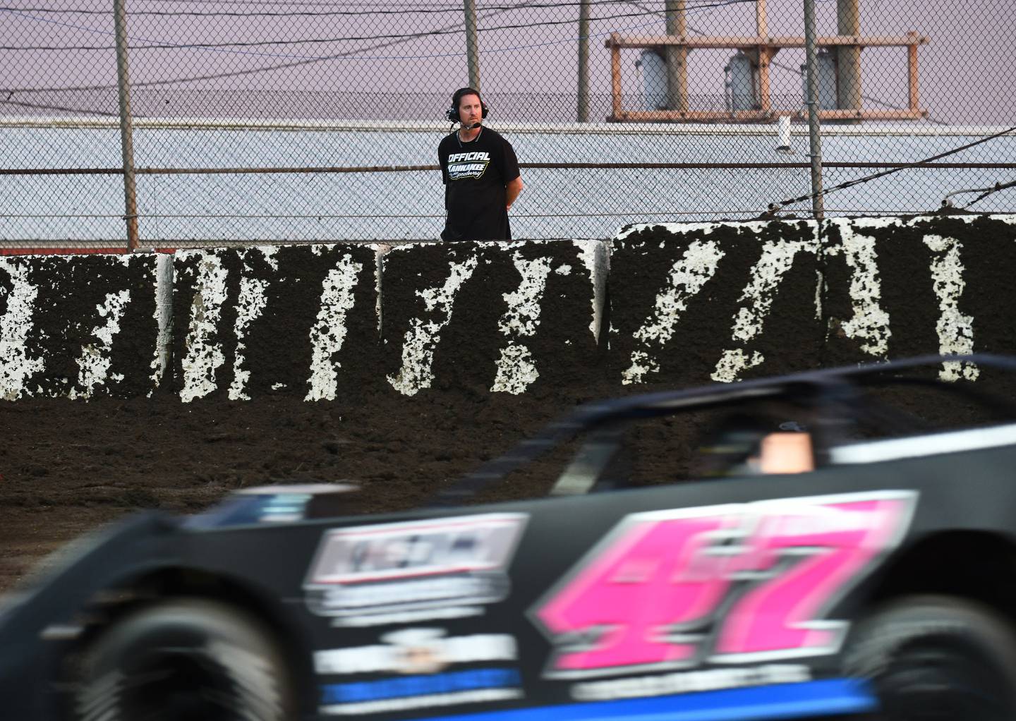 Track promoter Billy Knippenberg Jr. watches a heat race begin at the Kankakee County Speedway during a 2022 race.