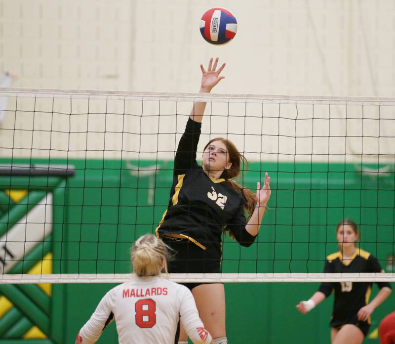Putnam County's Maggie Spratt (32) sends a kill past Henry's Talur Homann (8) in the Tri-County Conference Tournament on Monday, Oct. 10, 2022 in Seneca.