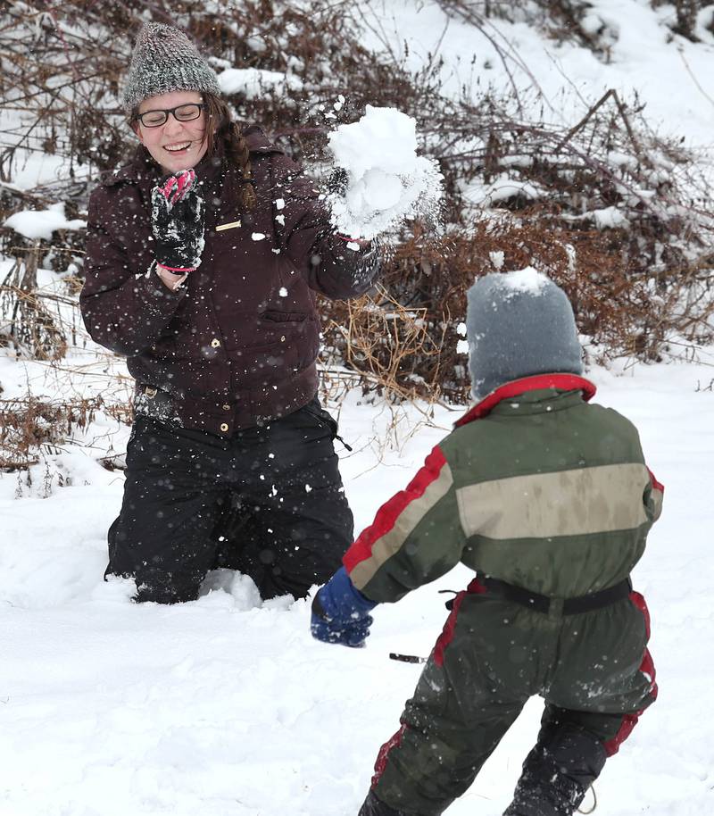 Elizabeth Sutter, 14, from DeKalb blocks a snowball thrown by her brother Isaiah, 4, Wednesday, Jan. 25, 2023, at Hopkins Park in DeKalb.